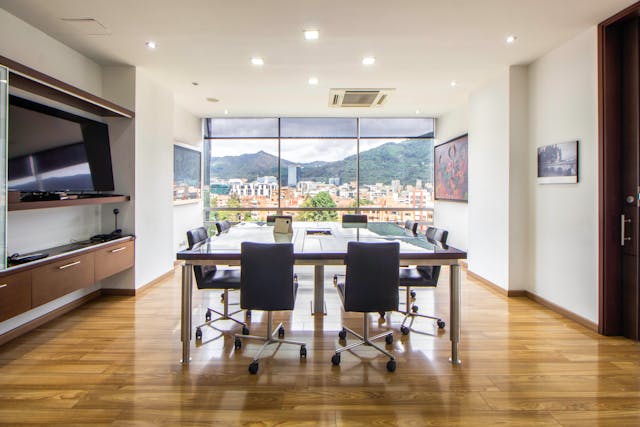 Modern conference room with a large wooden meeting table in Florida